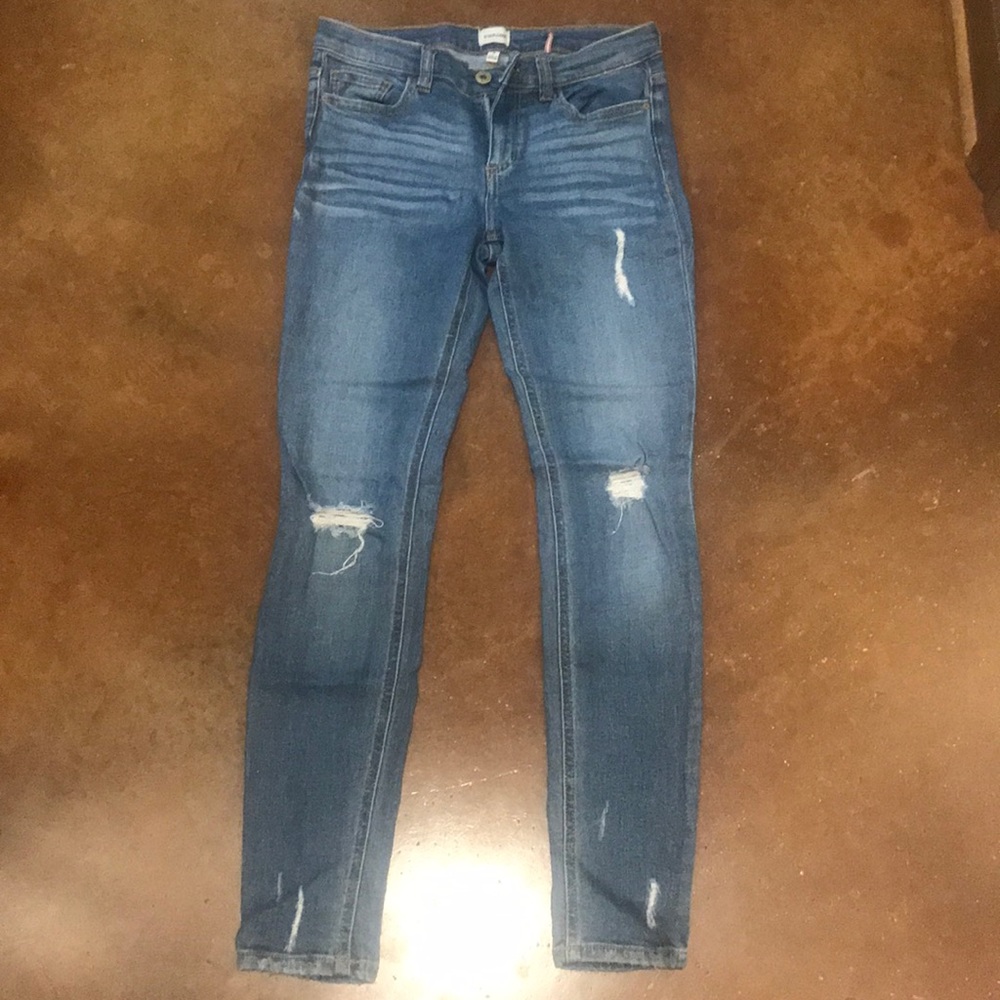 Mid rise sneak peek distressed skinny jeans